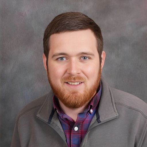 A headshot image of Joseph King