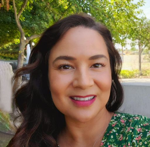 A headshot image of Marcie Quiroz