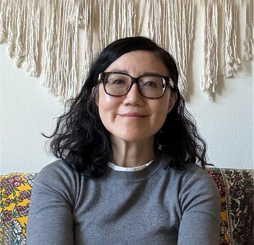 A headshot image of Yi Zhang