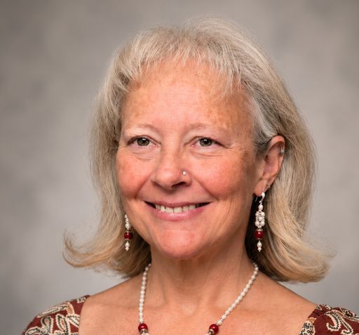 A headshot image of Alyce Oxton