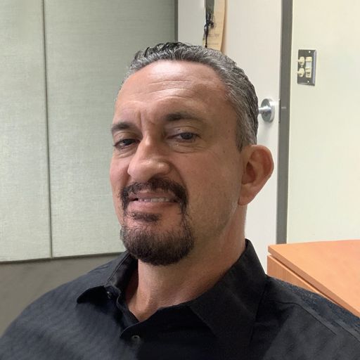 A headshot image of Hector Estrada