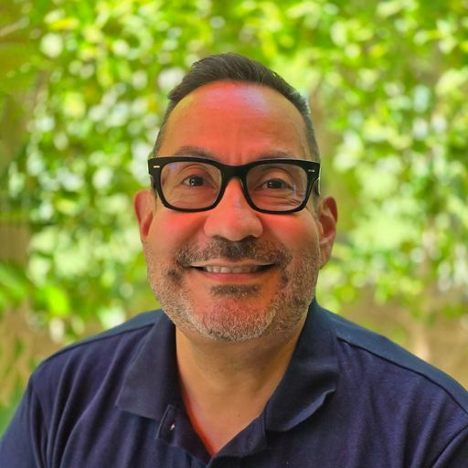 A headshot image of Carlos Luna