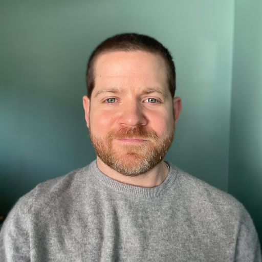 A headshot image of Brian Stacey