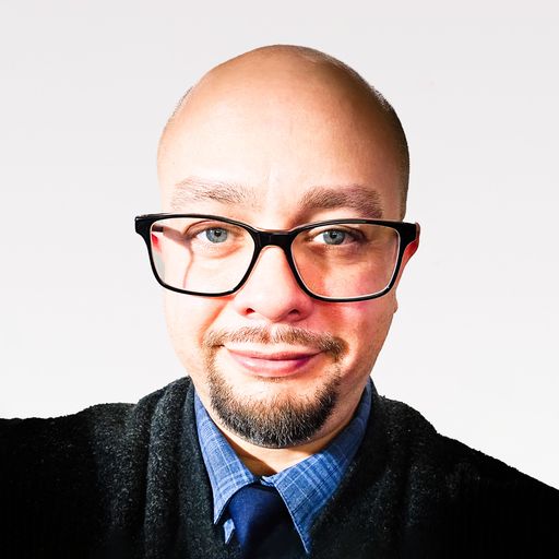 A headshot image of Justin Delgado