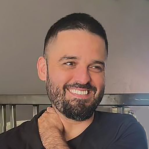 A headshot image of Miguel Hernandez