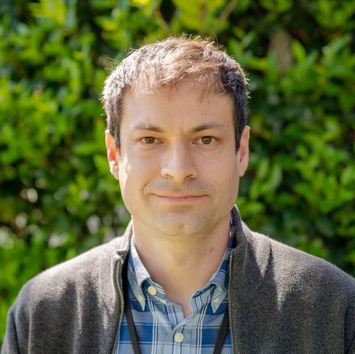 A headshot image of Alex Kaplan