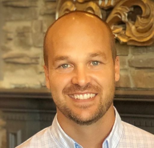 A headshot image of Adam Turner