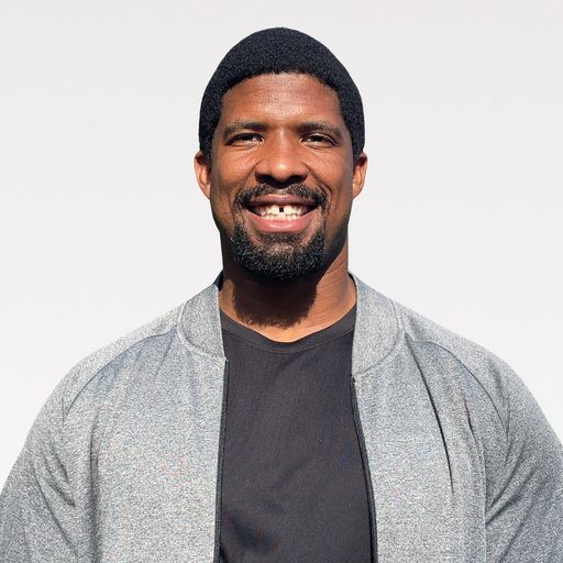 A headshot image of Andrew Hudson