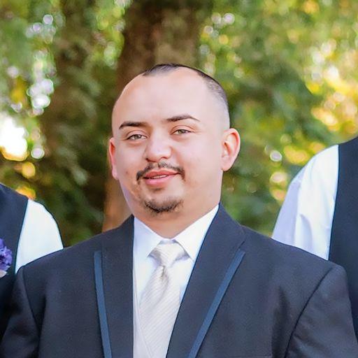 A headshot image of Erasmo San Juan