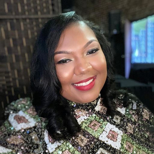 A headshot image of De'Andra Smith