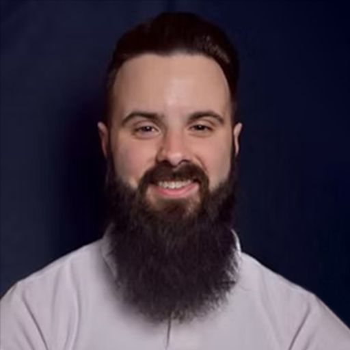 A headshot image of Lewis Holland