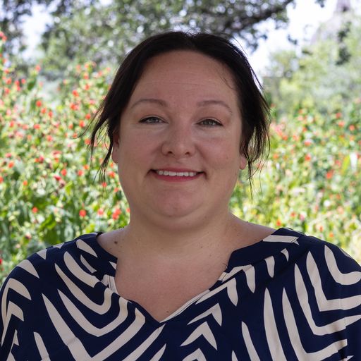 A headshot image of Caitlin Riojas