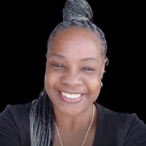 A headshot image of Tika Shoulders