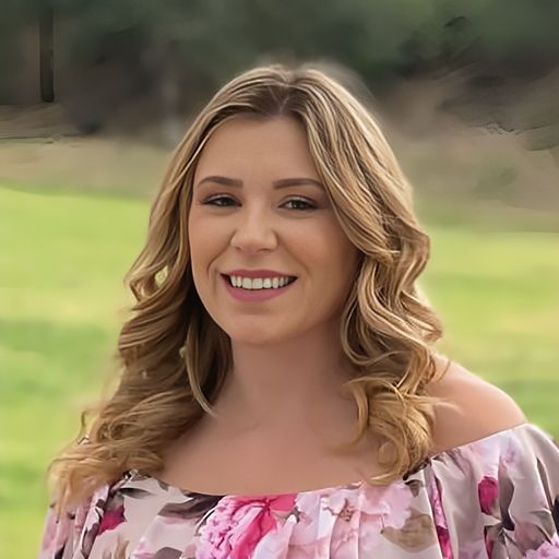 A headshot image of Genevie Umana
