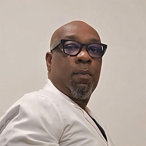 A headshot image of Patrick Okeke