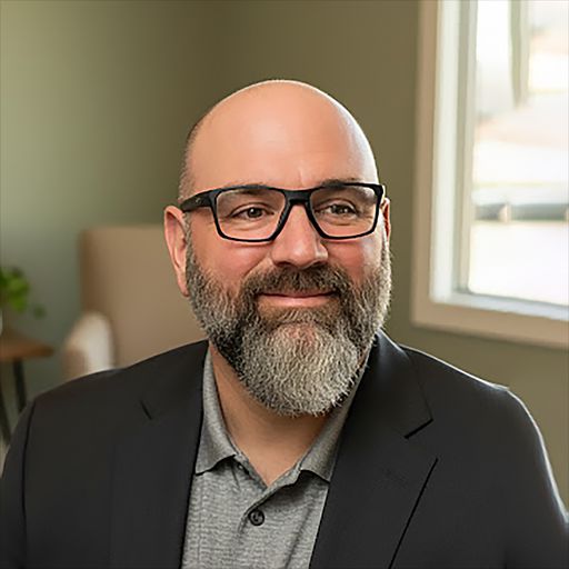 A headshot image of Joshua Pelfrey