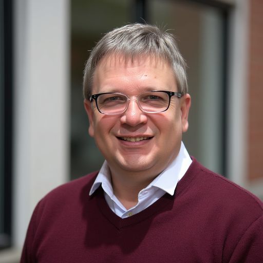 A headshot image of Adam Cooper