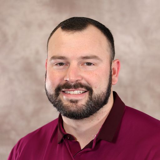 A headshot image of Michael Patrick