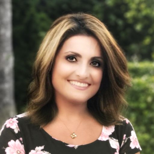 A headshot image of Nona Ghazban
