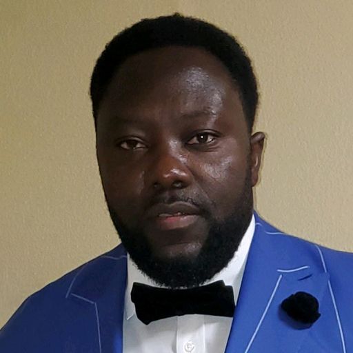 A headshot image of Emmanuel Mbi