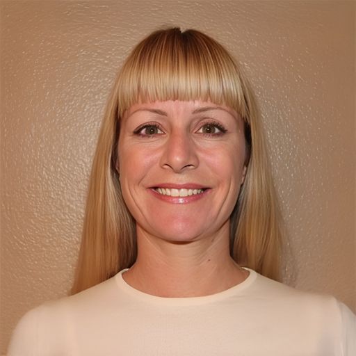 A headshot image of Andrea Guzman