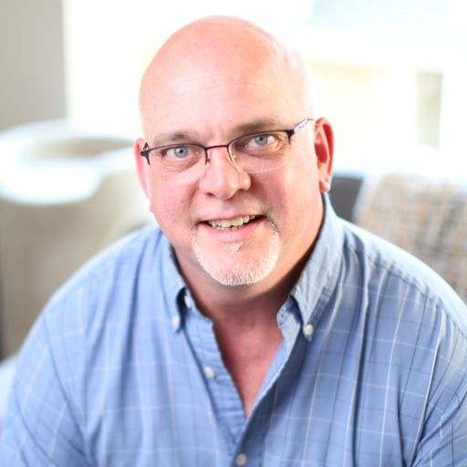 A headshot image of John Buscher