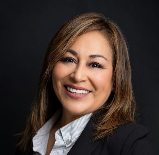 A headshot image of Roxanne Flores