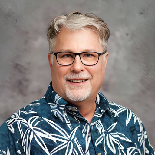A headshot image of Marc Komori Stager