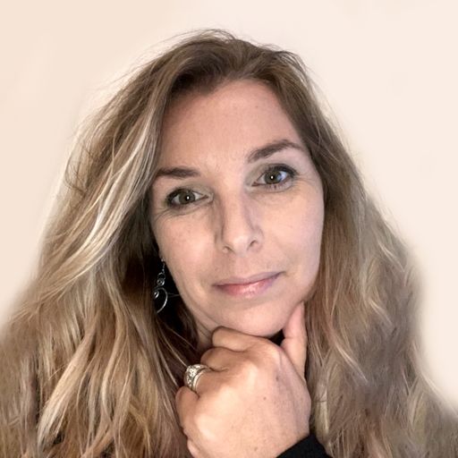 A headshot image of Mari Lynn Debon