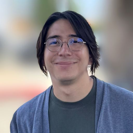 A headshot image of Adam Valdivia