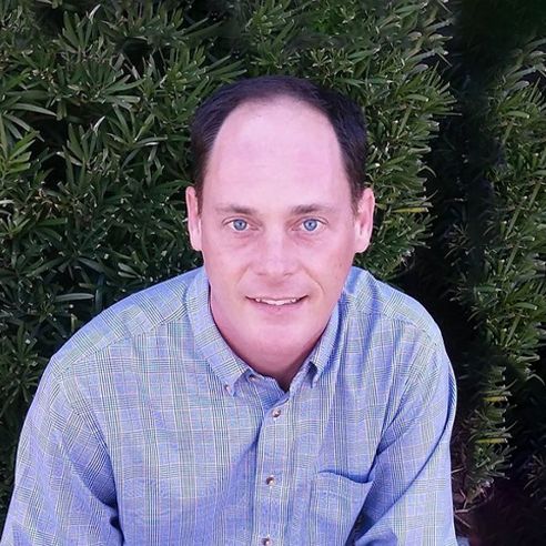 A headshot image of Christopher McGinn