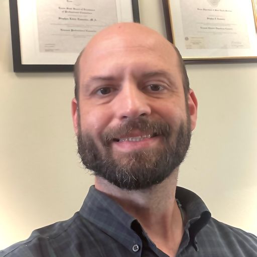 A headshot image of Stephen Tomutsa