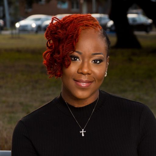 A headshot image of Shaena Wiggins