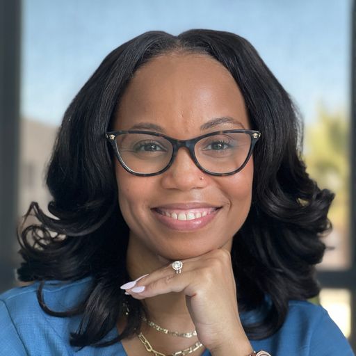 A headshot image of Takira Harvey-Robbins