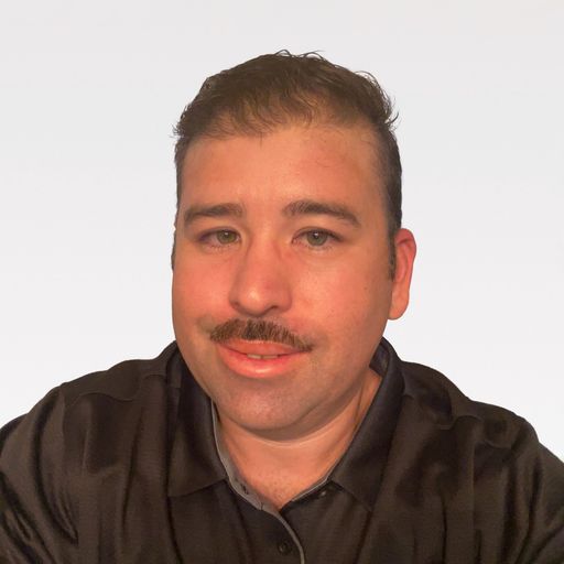 A headshot image of Richard Madrigal
