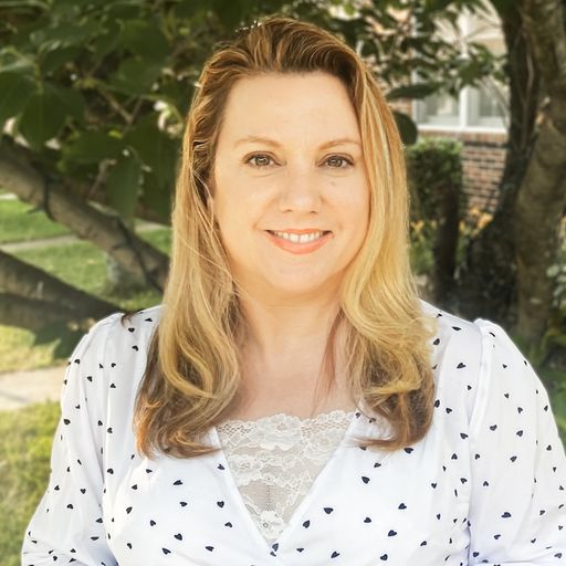 A headshot image of Barbara-Jeanne Dougherty-Vied