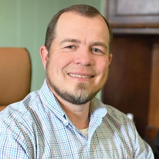 A headshot image of David Adams