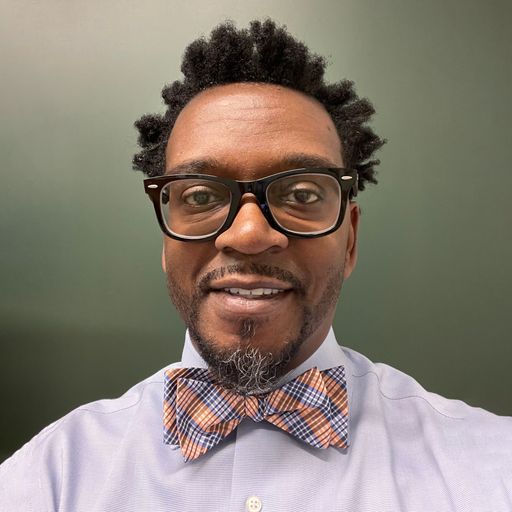 A headshot image of Tory Woodard