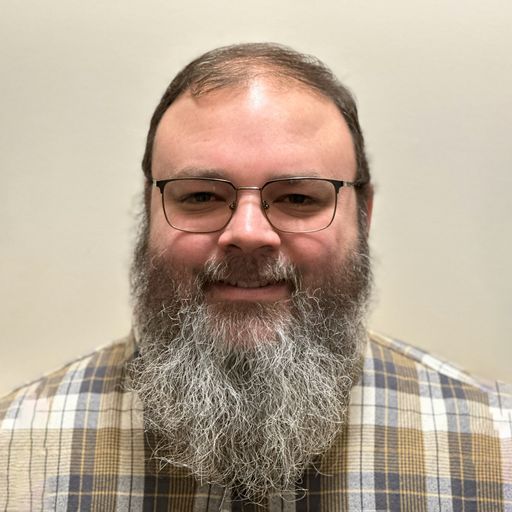 A headshot image of John Ramirez