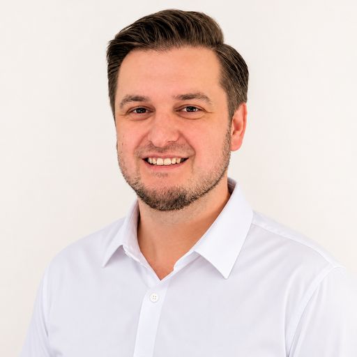 A headshot image of Yevgeniy Khadzhi