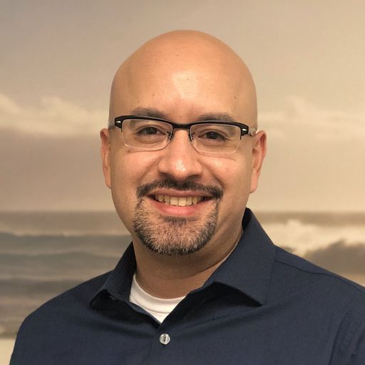 A headshot image of Alex Andrade