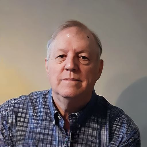 A headshot image of John Turner