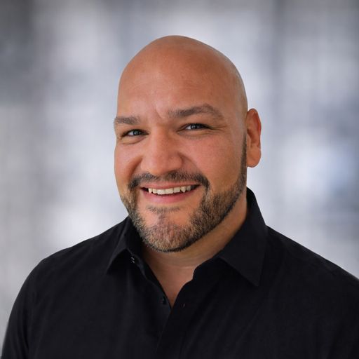 A headshot image of Adolph Delgado