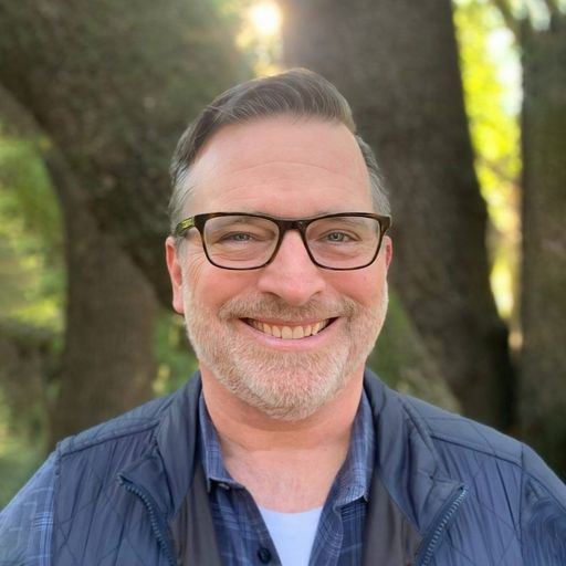 A headshot image of Ian Mason