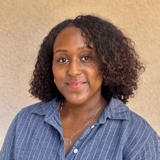 A headshot image of Maya Daley