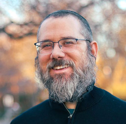 A headshot image of Aaron Silverman