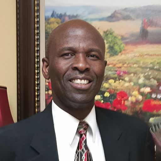 A headshot image of St Clair Alexander