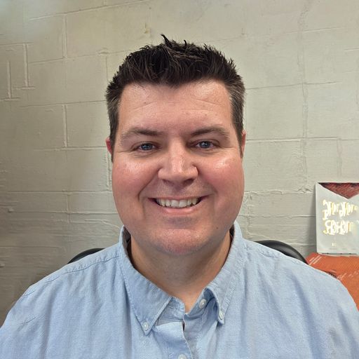 A headshot image of Matthew Nelson