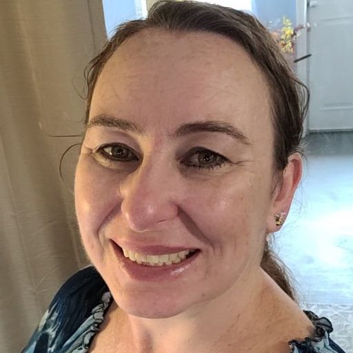 A headshot image of Genie James