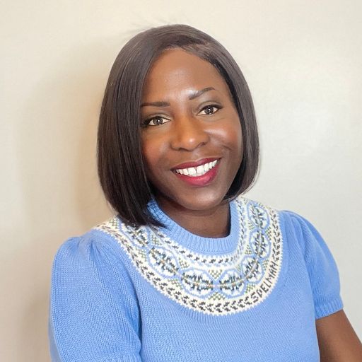 A headshot image of Alexis Benjamin